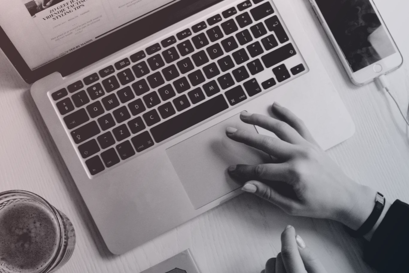 hand on laptop keyboard