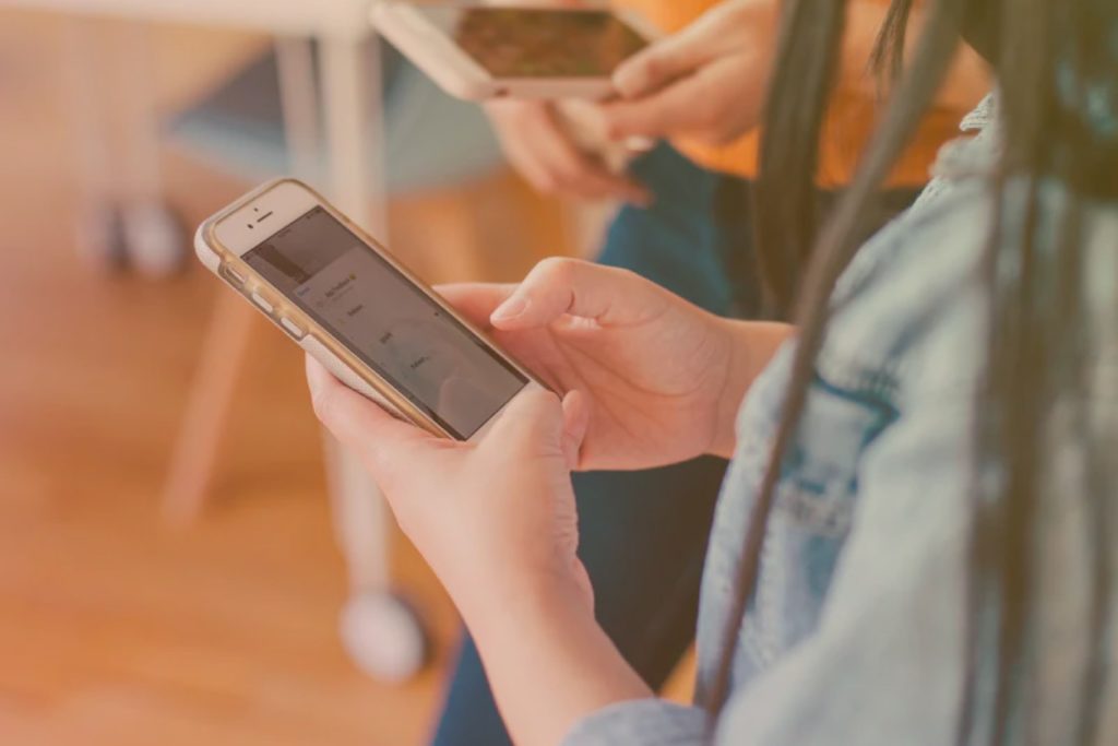 close up of persons hands holding a mobile phone