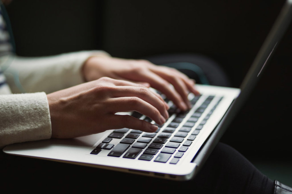 Online sales tips Man typing on laptop