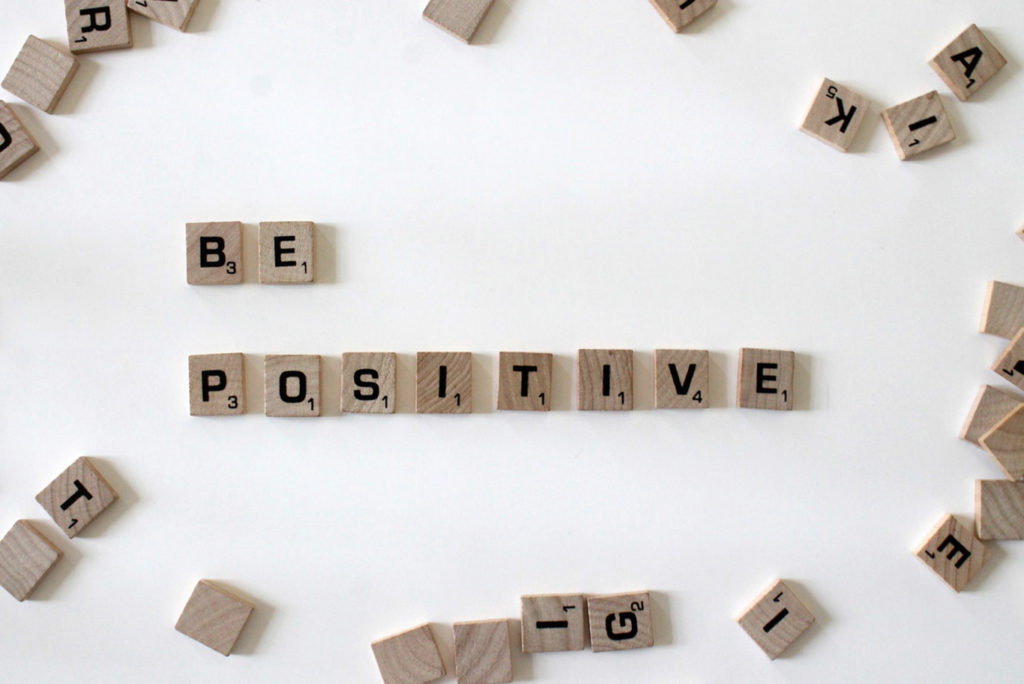 Scrabble spelling out be positive