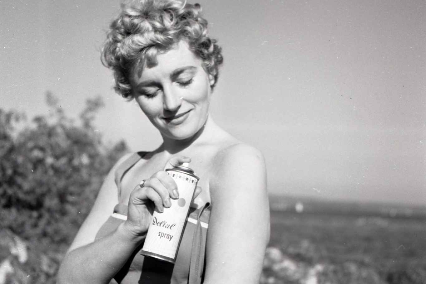 vintage style image of women with a spray can